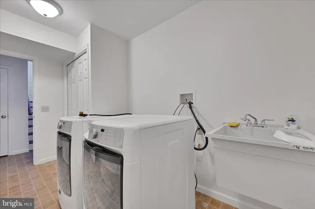 a storage room with cabinets and washer