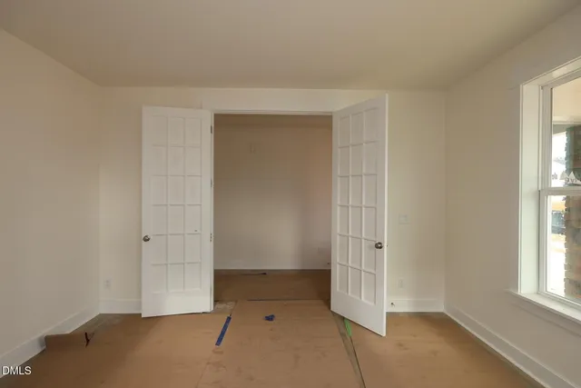 an empty room with windows