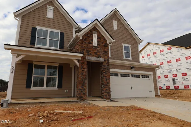 a view of a house with entrance gate