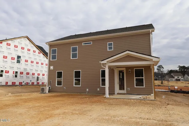 a front view of building with car parked
