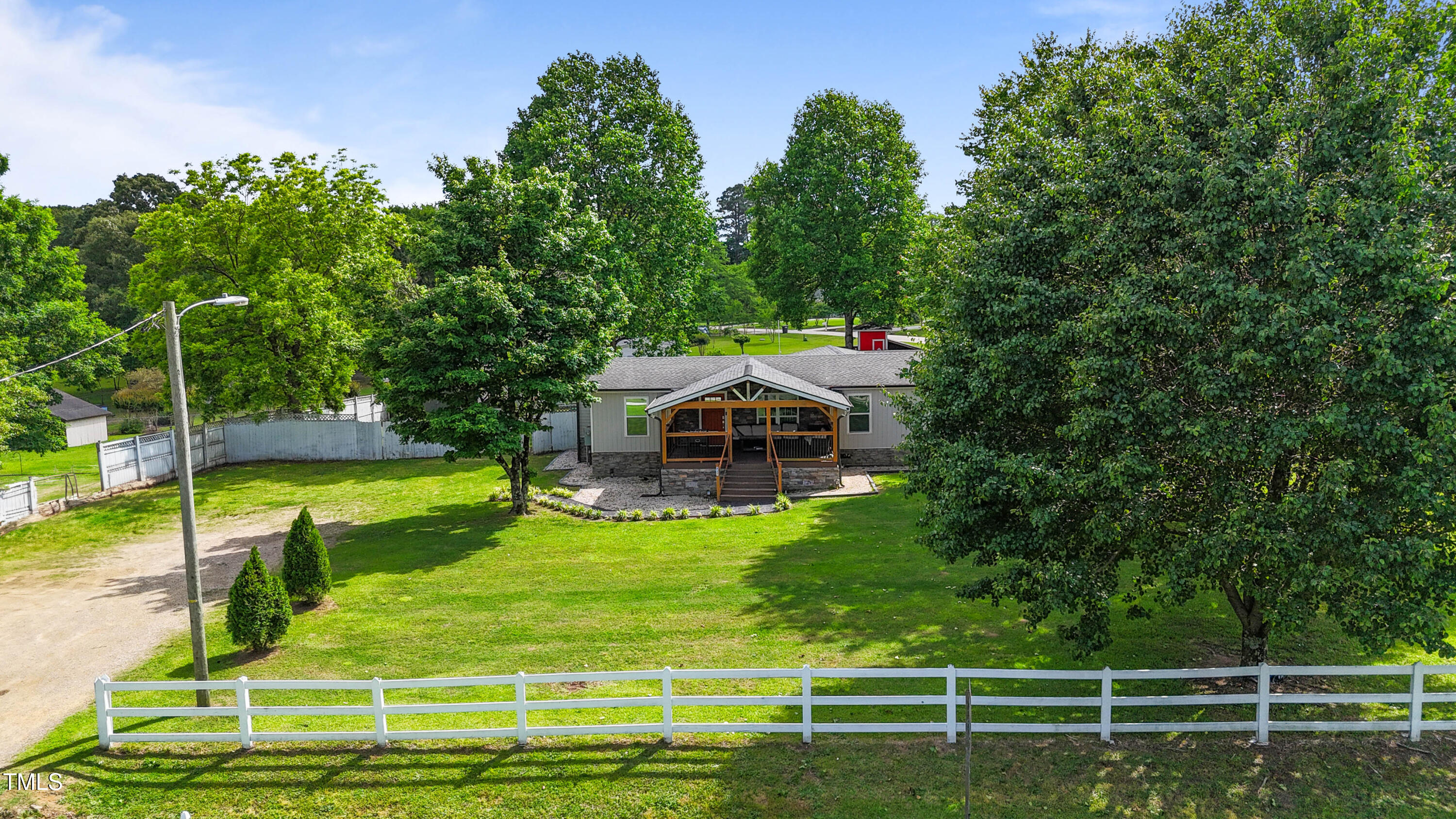 837 Lipscomb Road Angier, NC 27501 - Photo 25 of 27 a view of a house with a big yard