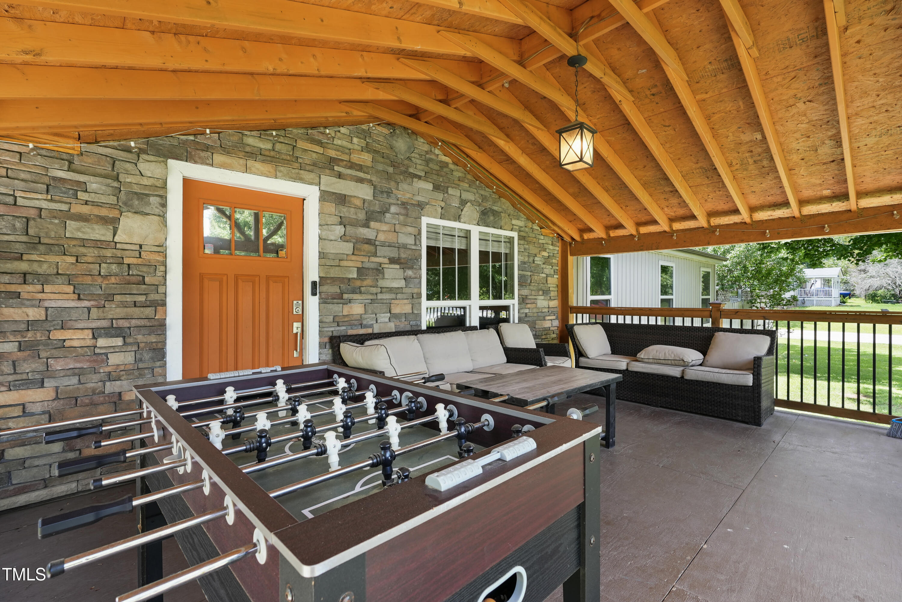 837 Lipscomb Road Angier, NC 27501 - Photo 3 of 27 a outdoor living space with patio furniture and potted plants