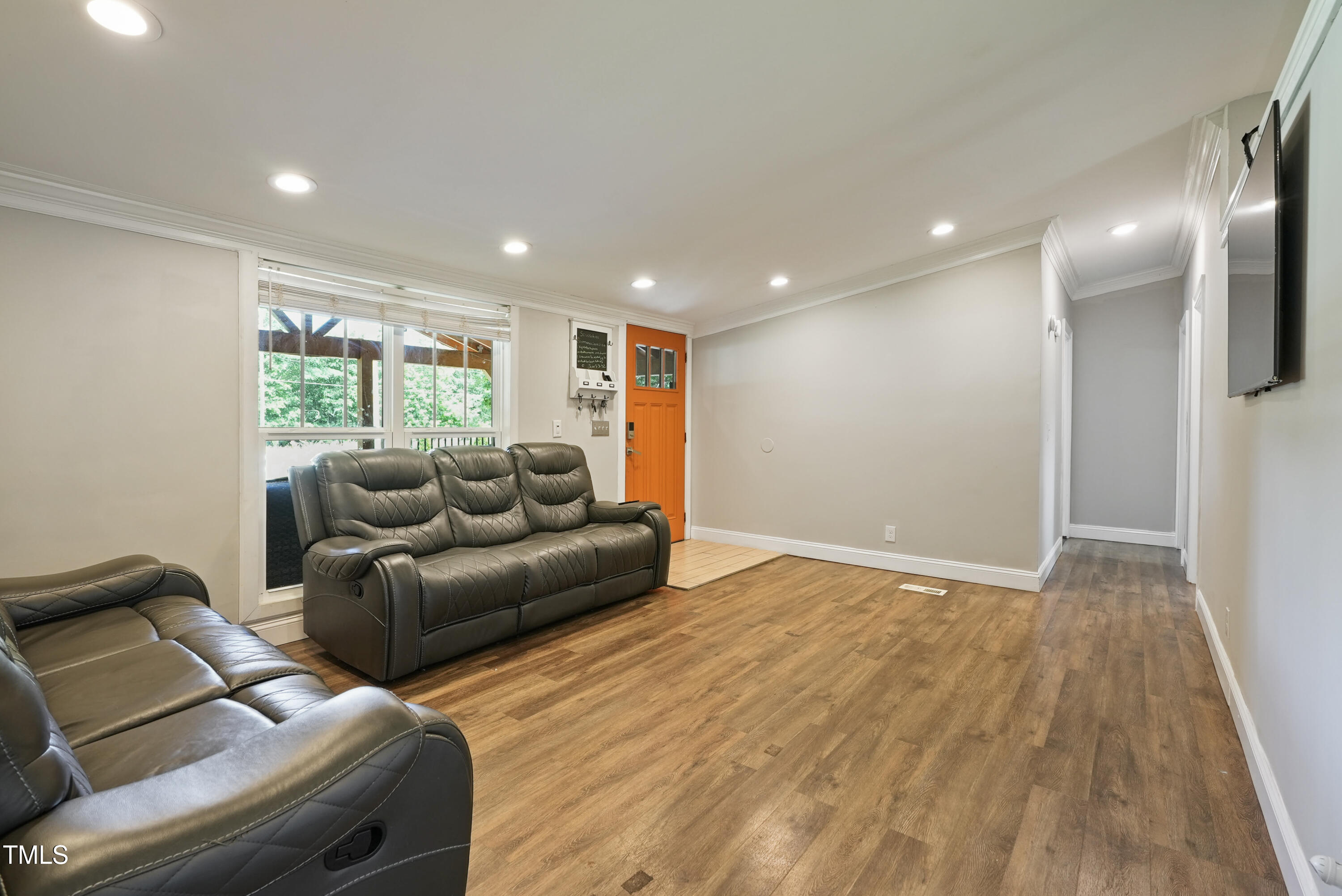 837 Lipscomb Road Angier, NC 27501 - Photo 5 of 27 a living room with furniture and a wooden floor
