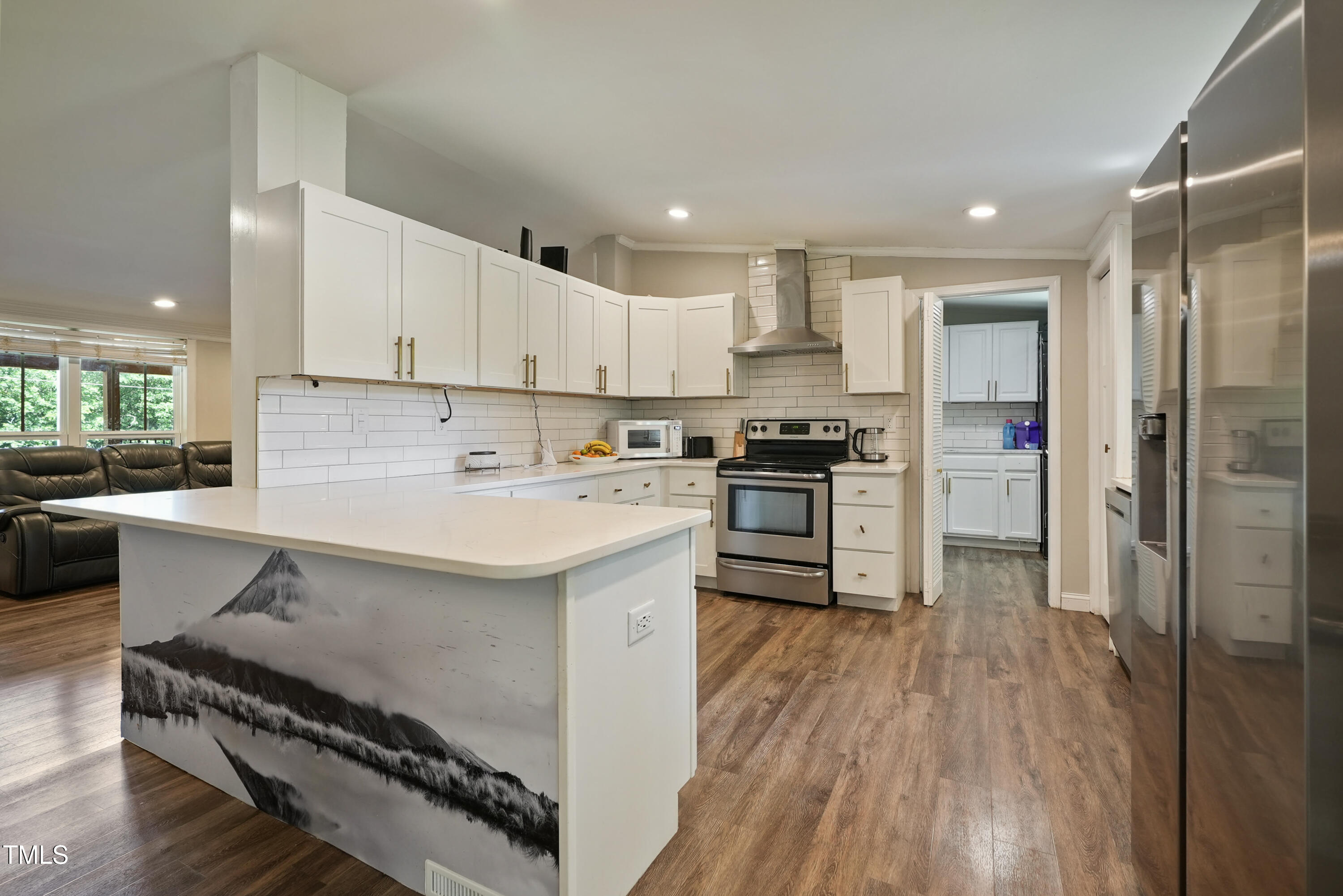837 Lipscomb Road Angier, NC 27501 - Photo 8 of 27 a kitchen with a sink stainless steel appliances and cabinets