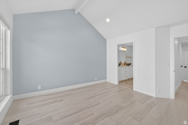 6969 South 855 East Midvale, UT 84047 - Photo 26 of 55 Vaulted ceiling with recessed lighting, light wood-finish flooring, and a large window with grilles