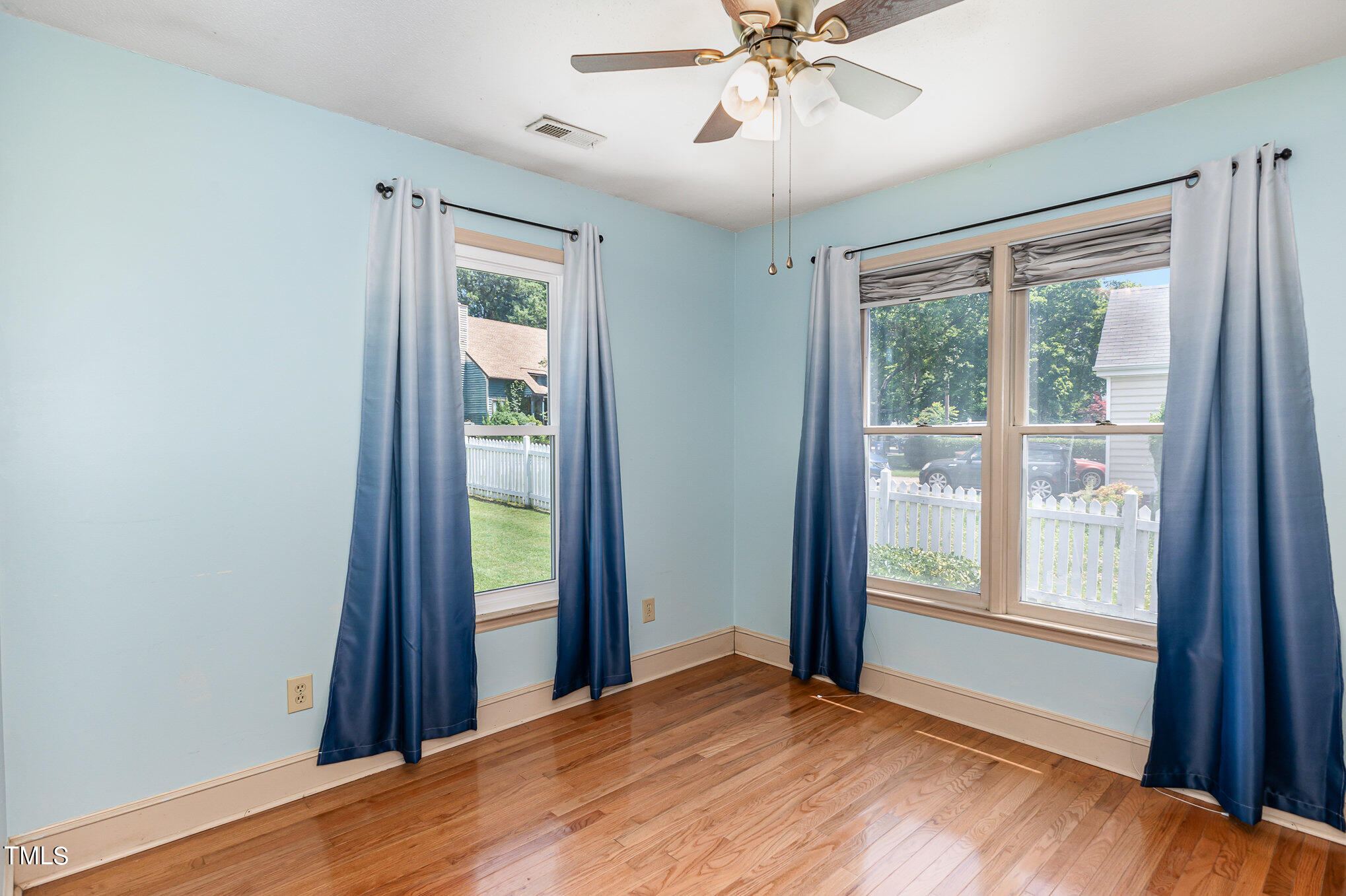 1921 Carthage Circle Raleigh, NC 27604 - Photo 12 of 19 a view of an empty room with window and wooden floor