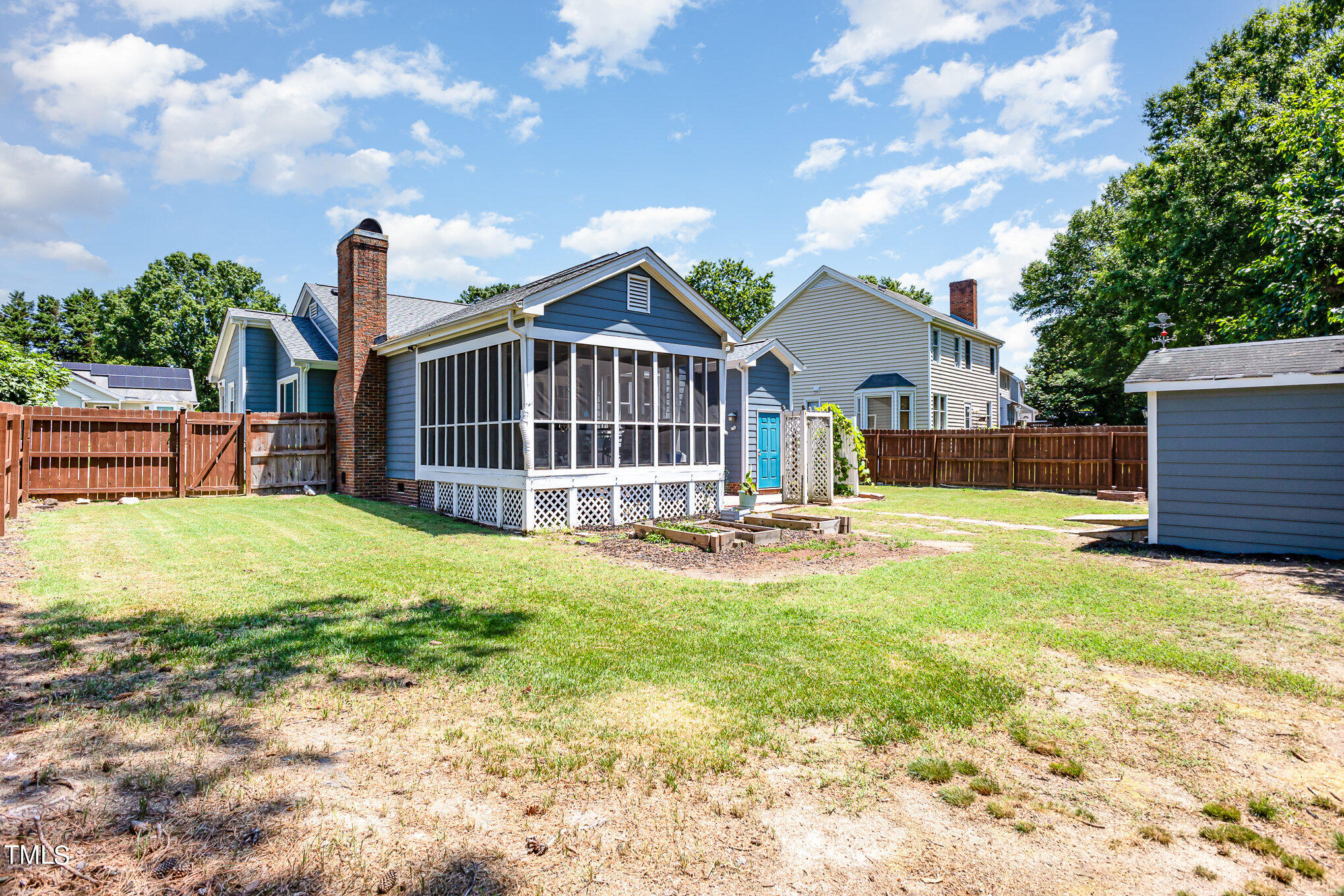 1921 Carthage Circle Raleigh, NC 27604 - Photo 17 of 19 a view of a house with a yard and wooden fence