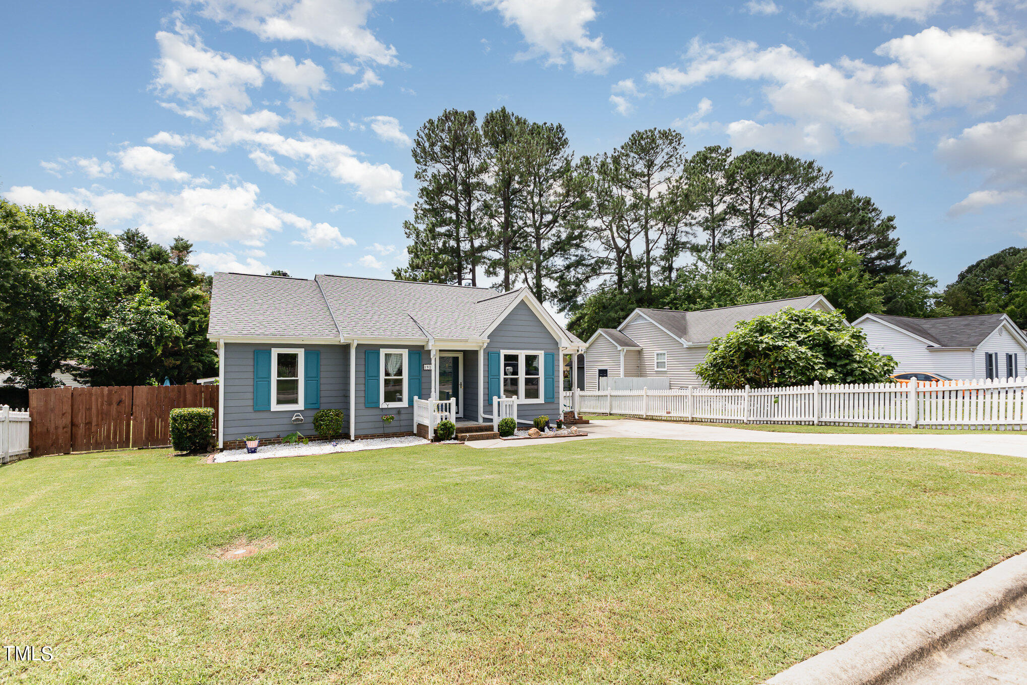 1921 Carthage Circle Raleigh, NC 27604 - Photo 3 of 19 a front view of a house with a garden and trees