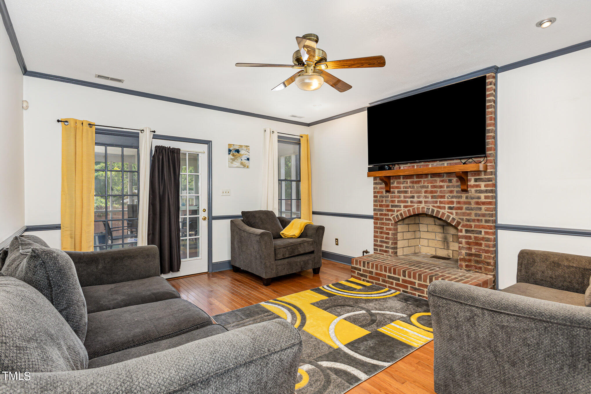 1921 Carthage Circle Raleigh, NC 27604 - Photo 7 of 19 a living room with fireplace furniture and a flat screen tv