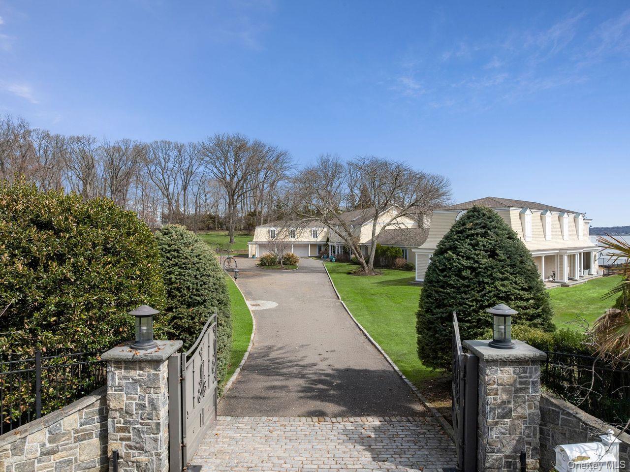 33 Beach Road Northport, NY 11768 - Photo 3 of 50 a view of a street with of houses in the background