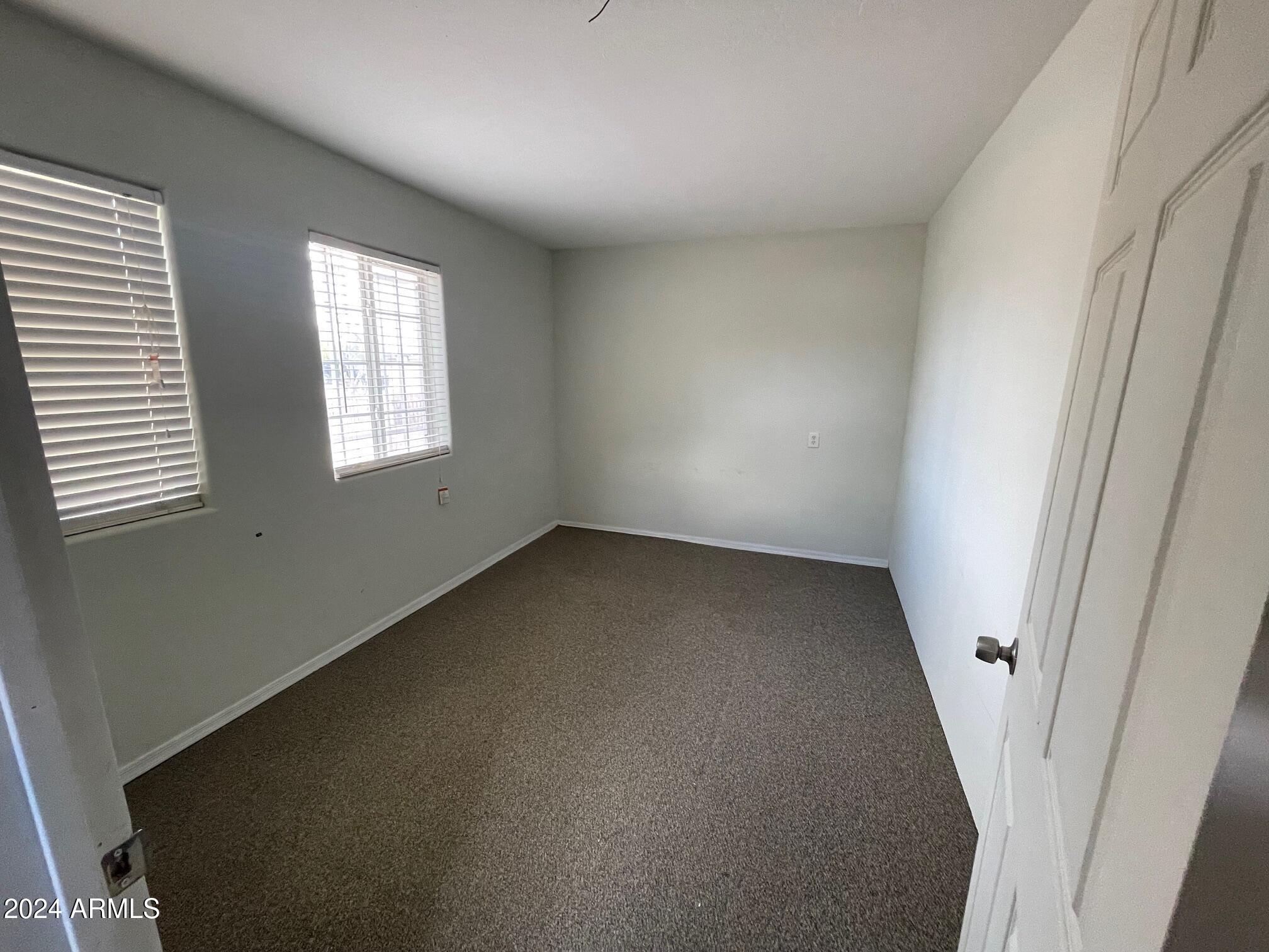 115 West 10th Street Casa Grande, AZ 85122 - Photo 12 of 14 an empty room with a window