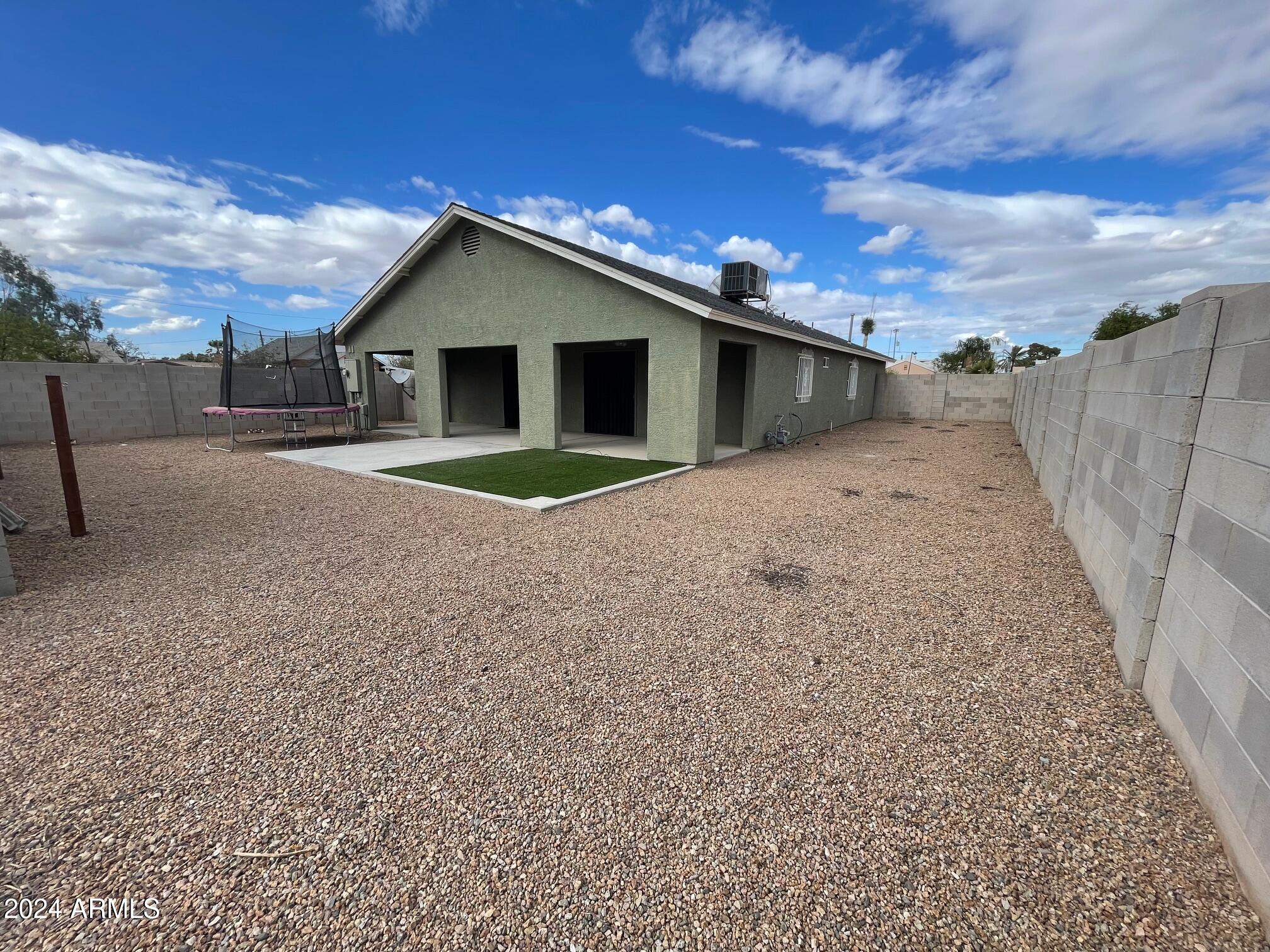 115 West 10th Street Casa Grande, AZ 85122 - Photo 13 of 14 a wooden house with a yard