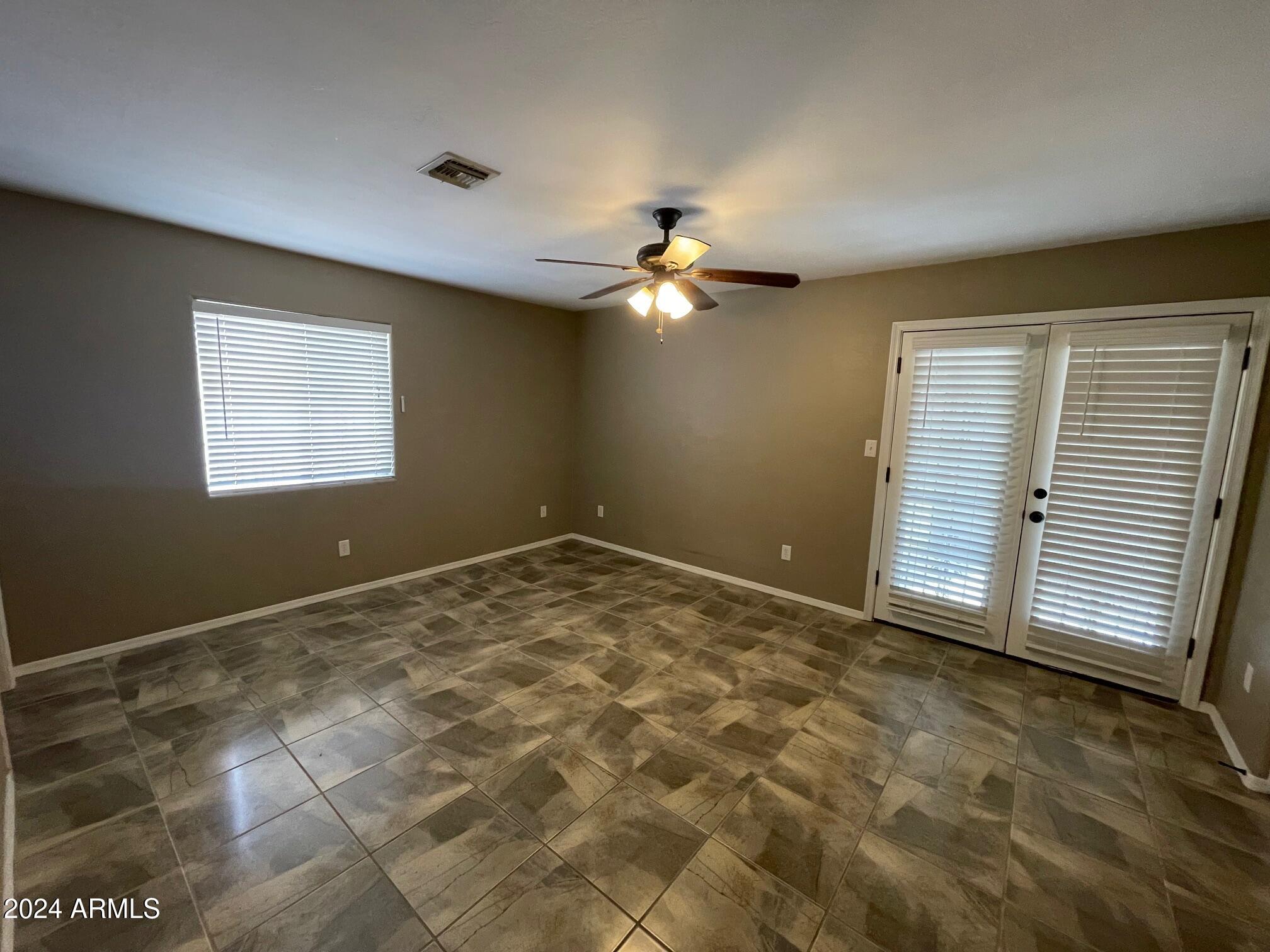 115 West 10th Street Casa Grande, AZ 85122 - Photo 6 of 14 a view of an empty room with a window