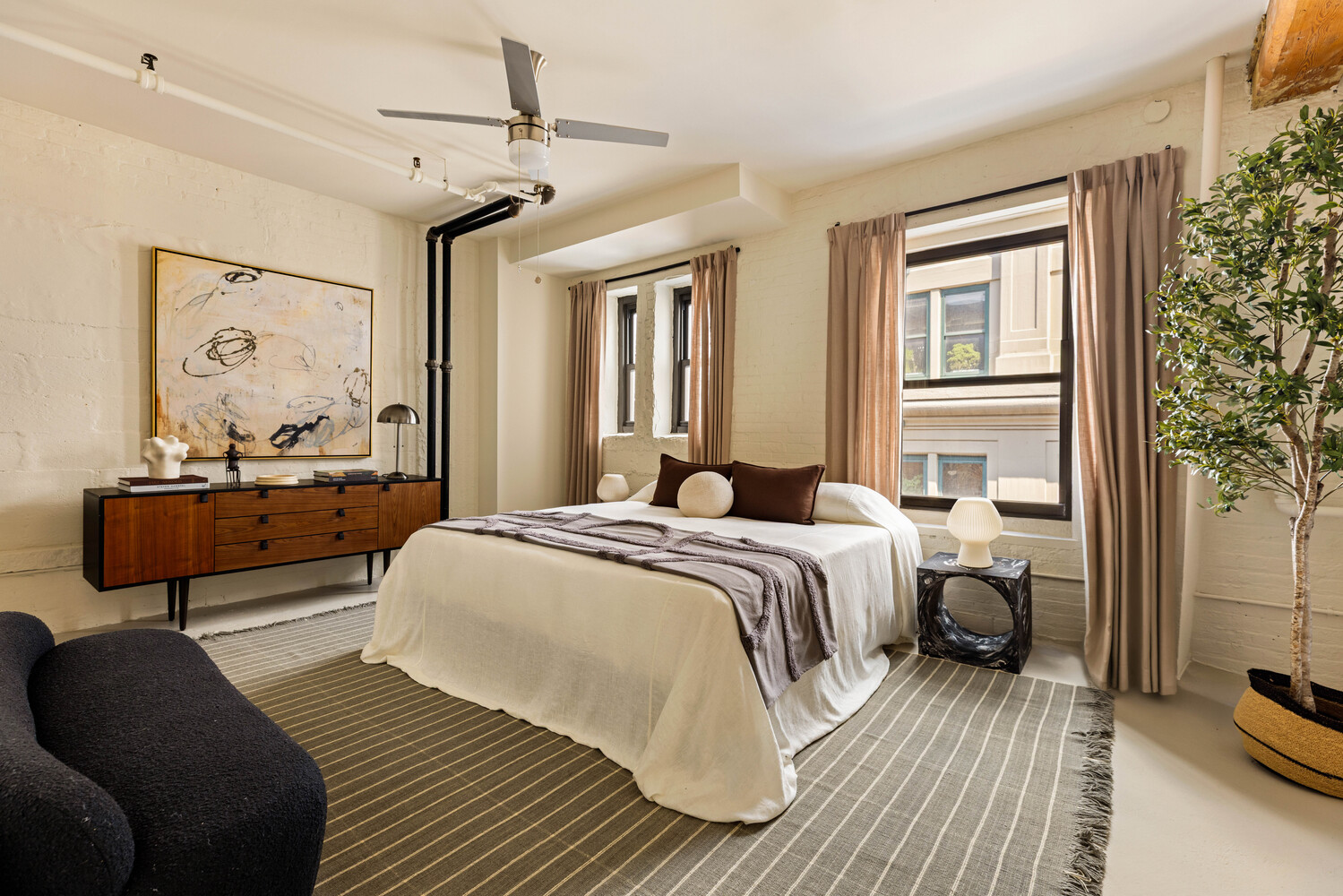 39 Pearl Street, Unit 4R Brooklyn, NY 11201 - Photo 12 of 23 a bedroom with a bed and wooden floor