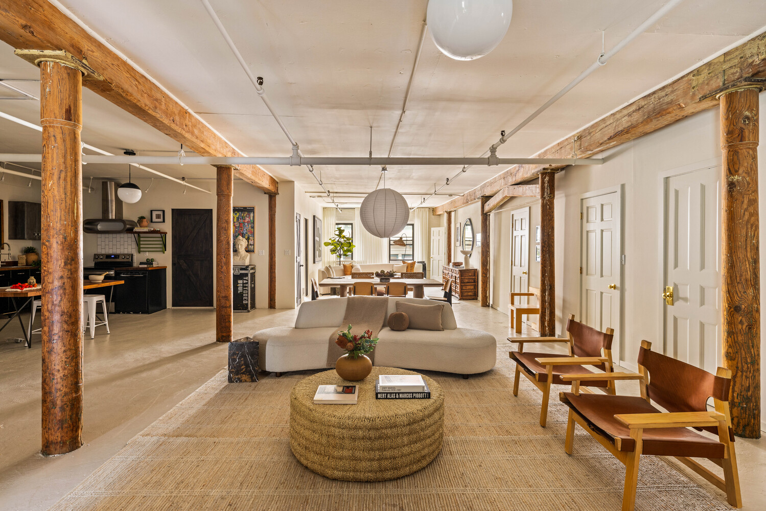 39 Pearl Street, Unit 4R Brooklyn, NY 11201 - Photo 2 of 23 a living room with furniture and a chandelier