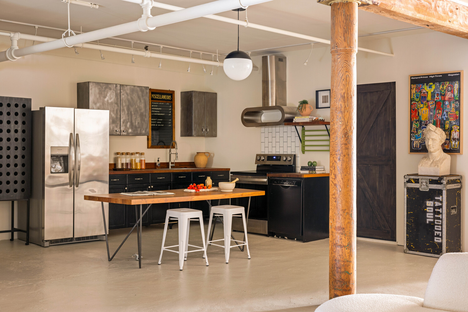 39 Pearl Street, Unit 4R Brooklyn, NY 11201 - Photo 8 of 23 a kitchen with stainless steel appliances kitchen island granite countertop a table and chairs in it