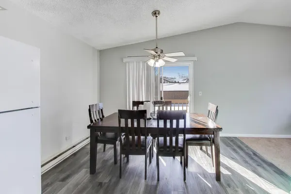 a view of a dining room with furniture window and wooden floor