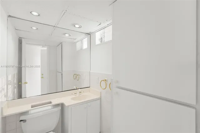 a bathroom with a shower and a sink