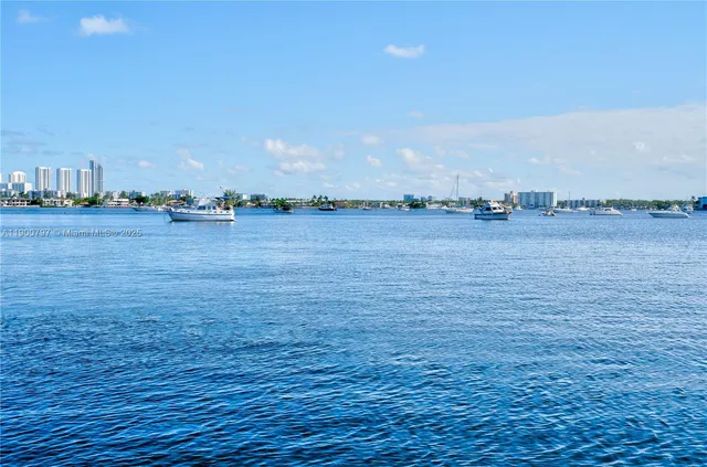 a sidewalk with a tall buildings in the background
