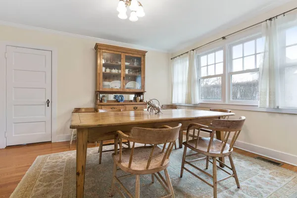 a view of a dining room with furniture and window