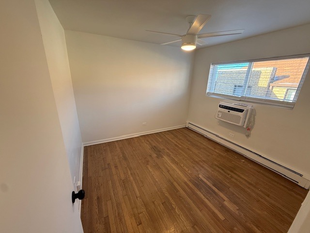 7357 North Winchester Avenue, Unit 2M Chicago, IL 60626 - Photo 6 of 12 wooden floor in an empty room