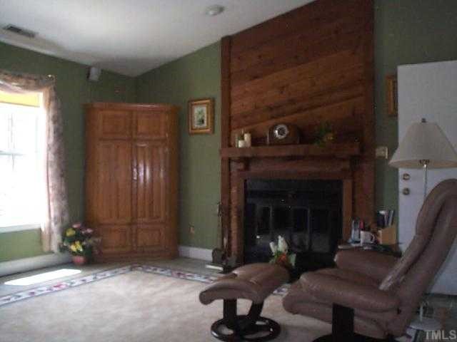 4500 Brost Court Raleigh, NC 27616 - Photo 5 of 10 Living Room with Fireplace and Cathedral Ceiling
