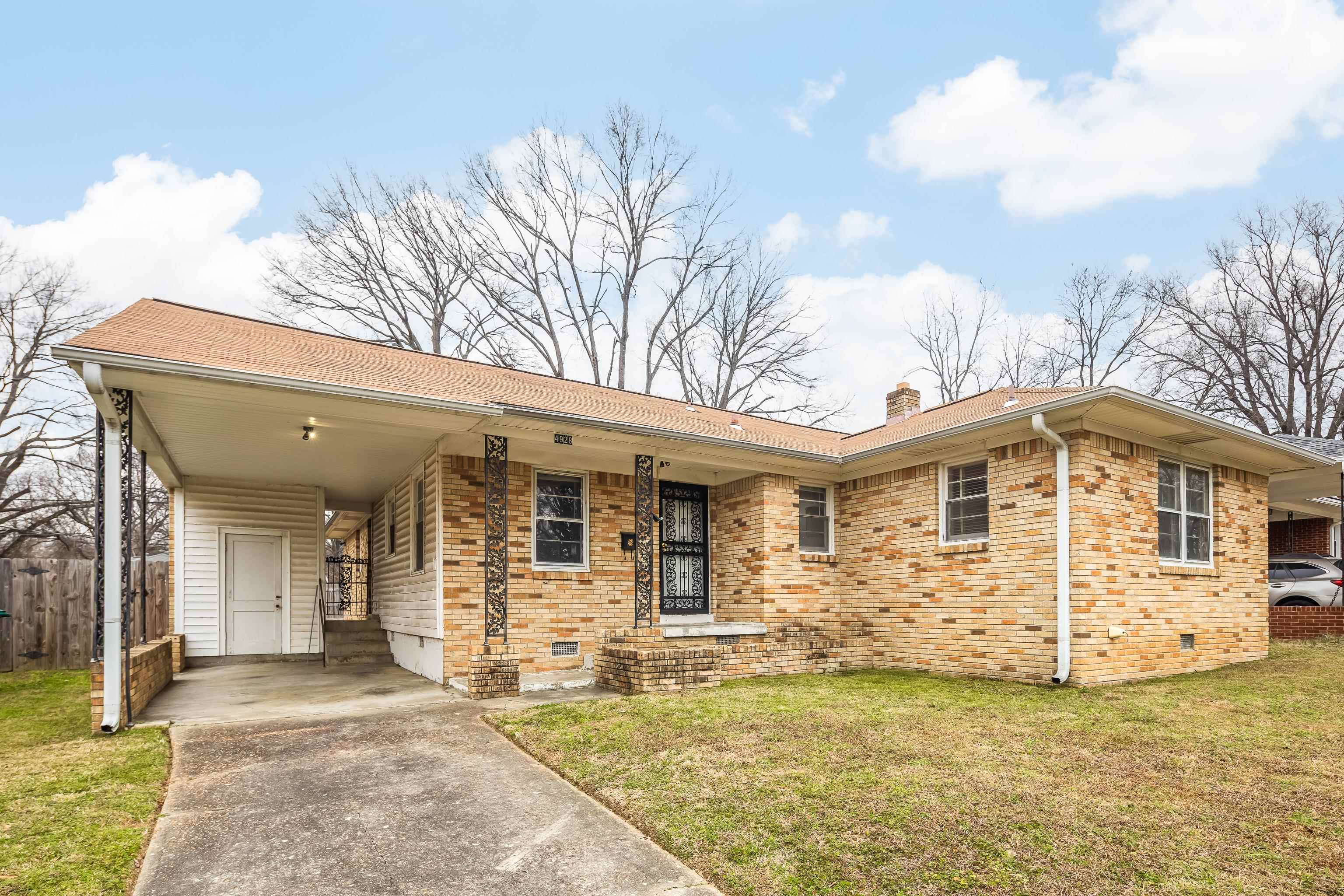 4928 Flamingo Road Memphis, TN 38117 - Photo 1 of 30 a front view of a house with a patio