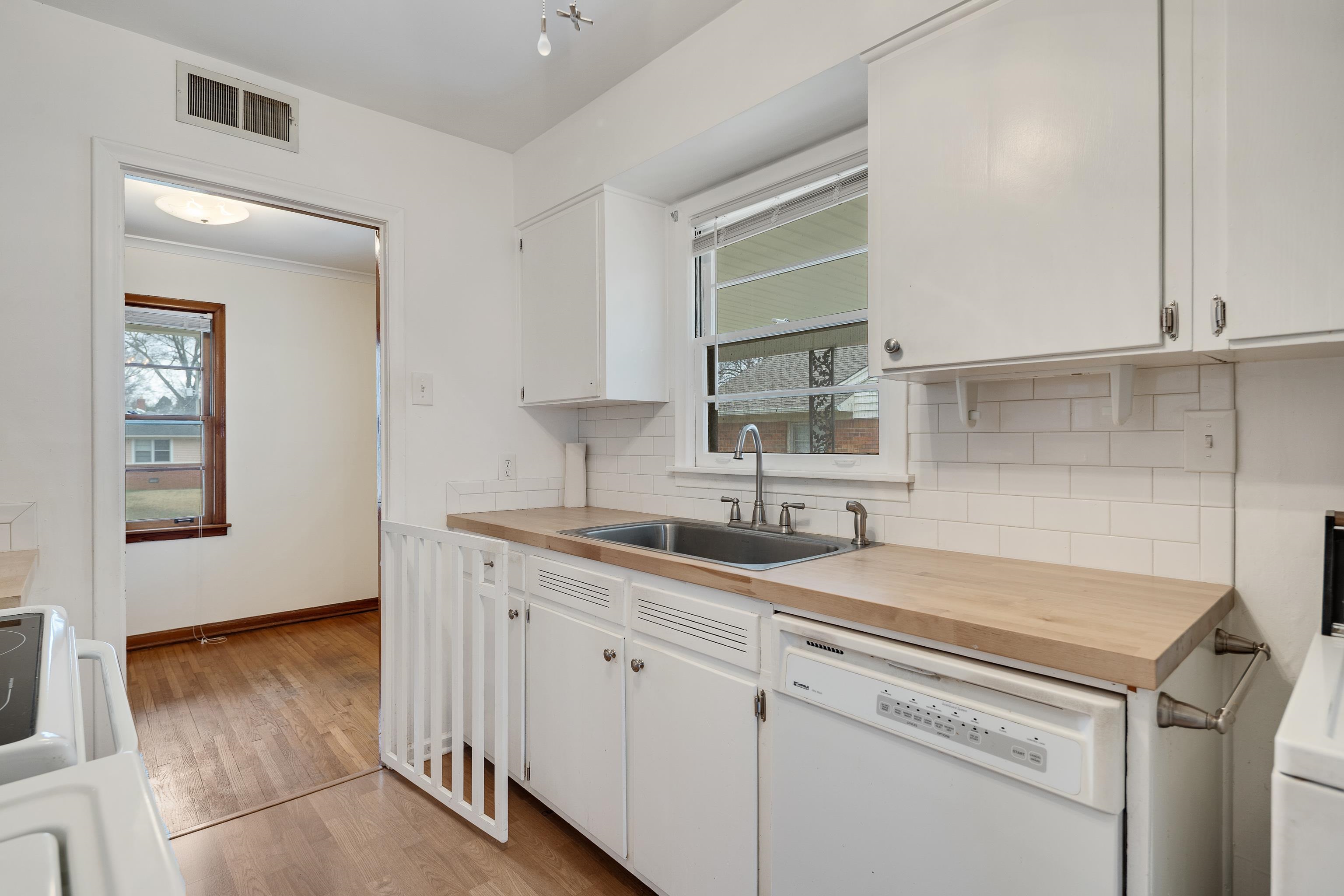 4928 Flamingo Road Memphis, TN 38117 - Photo 12 of 30 a kitchen with a sink and cabinets