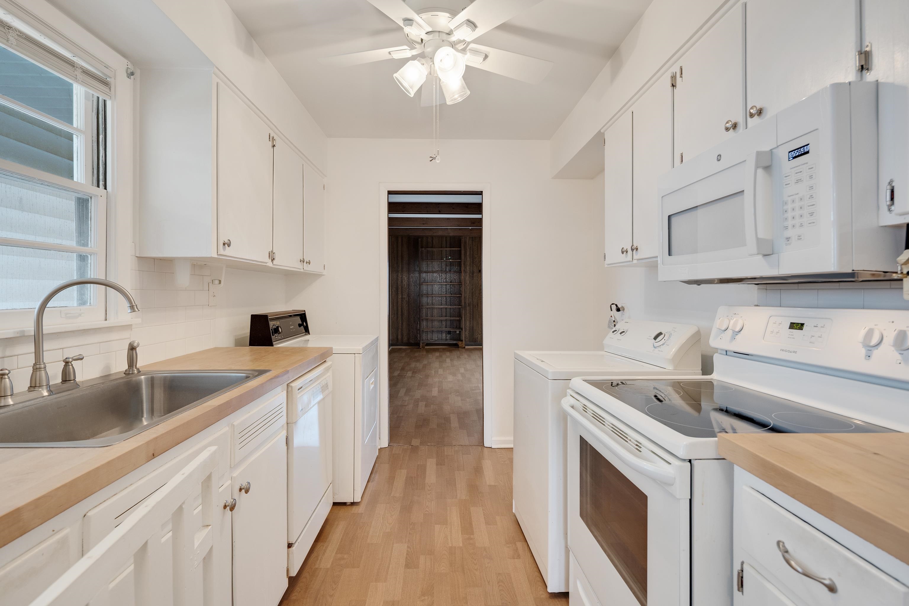 4928 Flamingo Road Memphis, TN 38117 - Photo 13 of 30 a kitchen with cabinets a sink and appliances