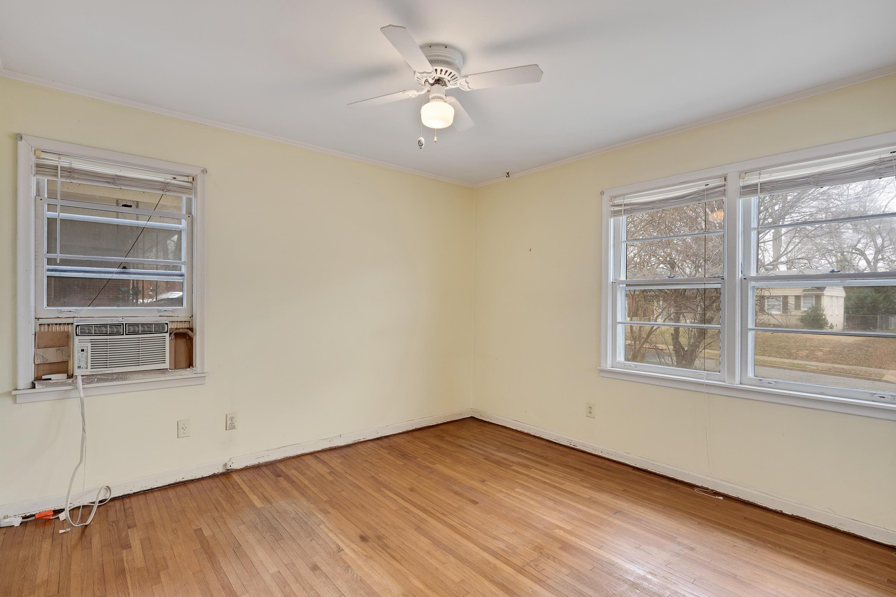 4928 Flamingo Road Memphis, TN 38117 - Photo 20 of 30 a view of an empty room with a window and wooden floor