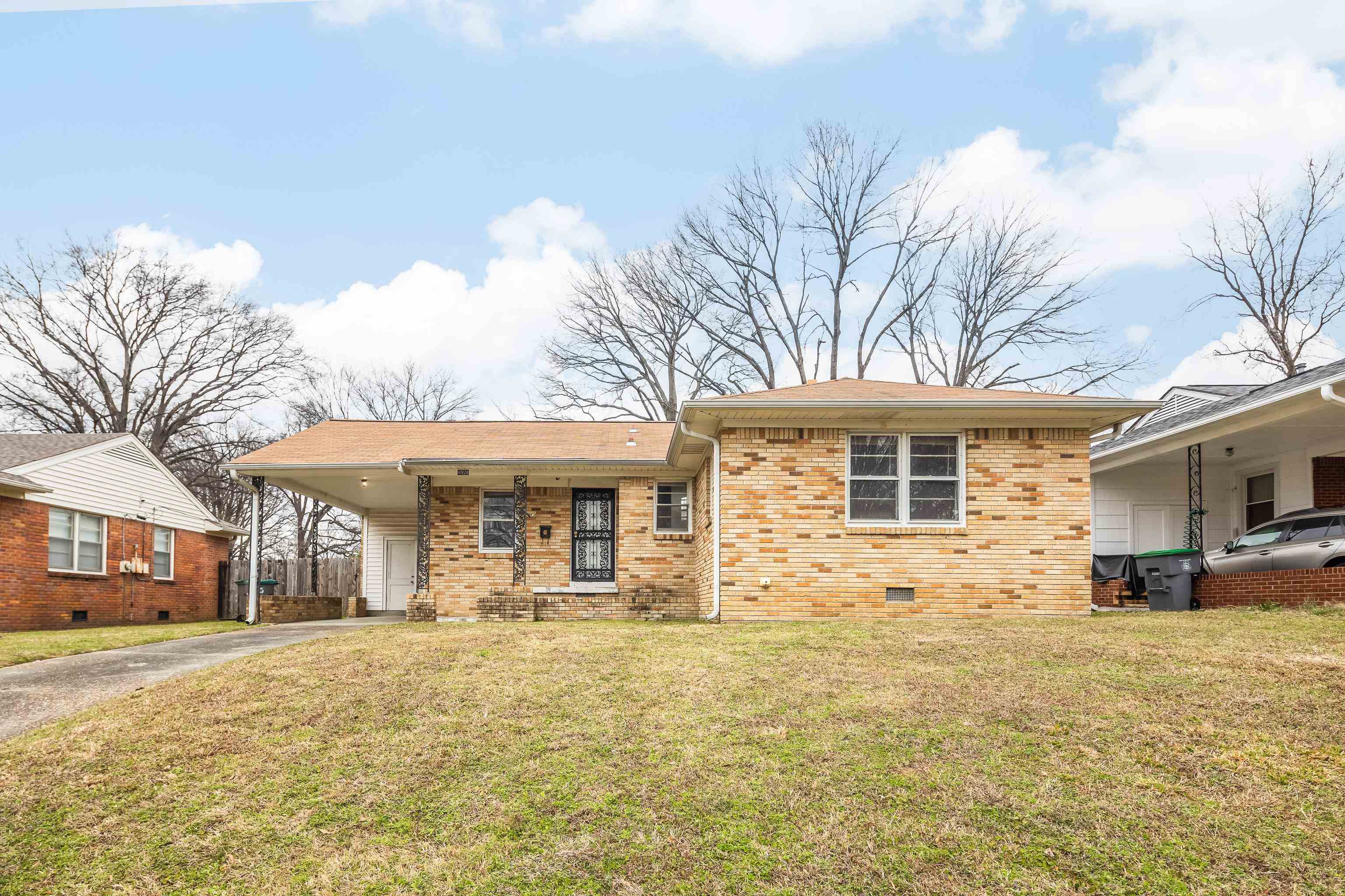 4928 Flamingo Road Memphis, TN 38117 - Photo 2 of 30 a front view of house with yard and trees in the background