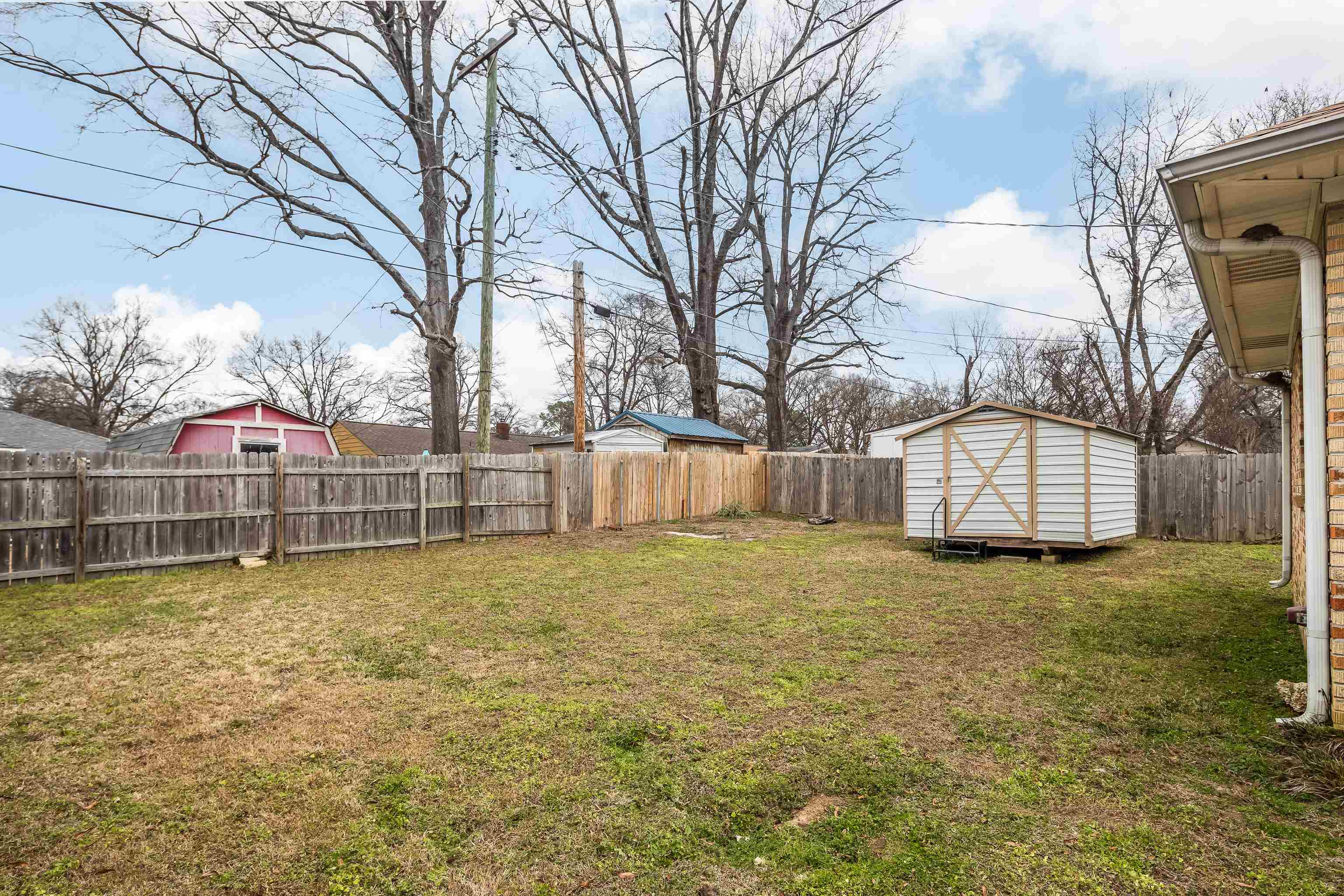 4928 Flamingo Road Memphis, TN 38117 - Photo 25 of 30 a view of a yard with a house and large trees