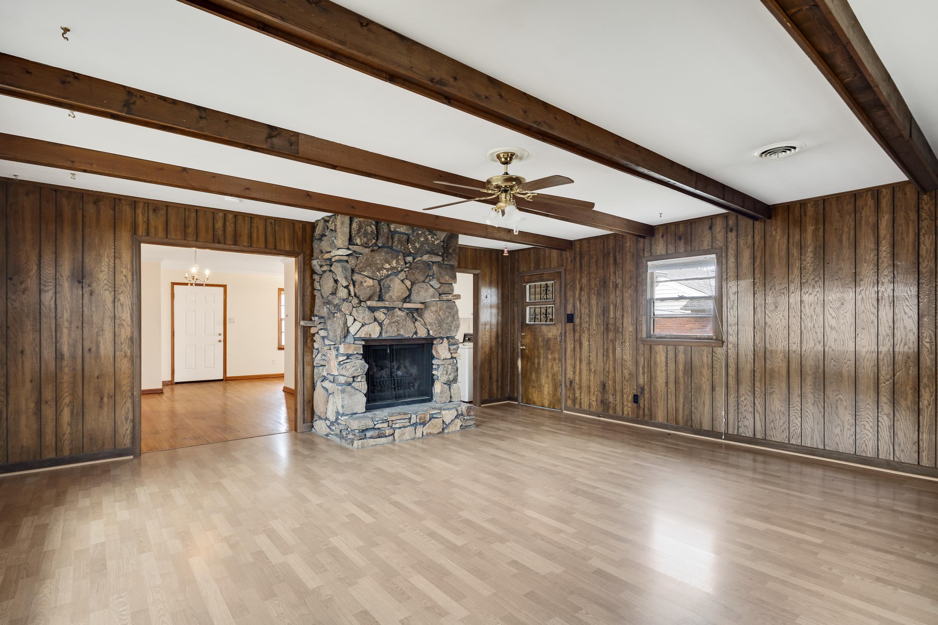 4928 Flamingo Road Memphis, TN 38117 - Photo 8 of 30 a view of an empty room with a fireplace and a window