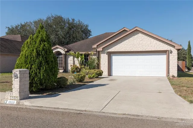 front view of a house and a yard