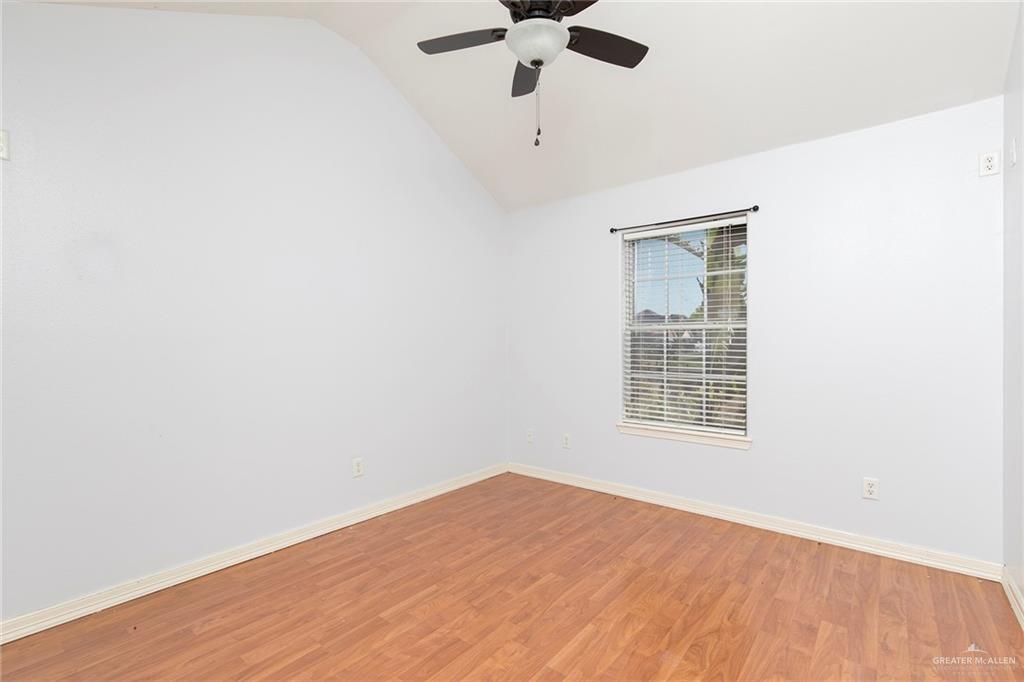 1909 Ezekiel Street Edinburg, TX 78542 - Photo 12 of 16 an empty room with a window and a ceiling fan