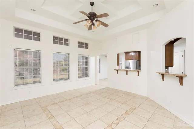 a bathroom with a granite countertop sink a mirror and shower