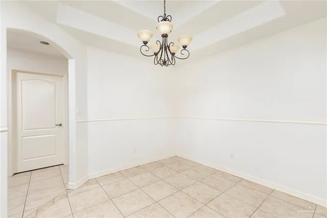 a kitchen with granite countertop a sink stove and refrigerator