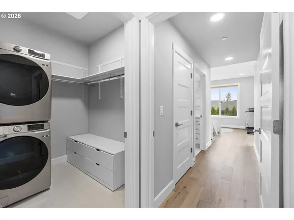 a view of a hallway with washer and dryer