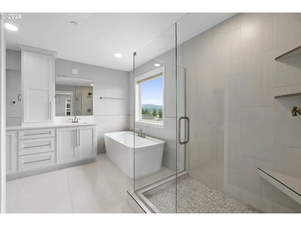 a bathroom with a sink a toilet a mirror and vanity