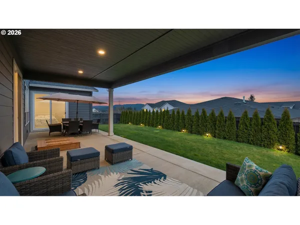 a outdoor living space with furniture and garden view