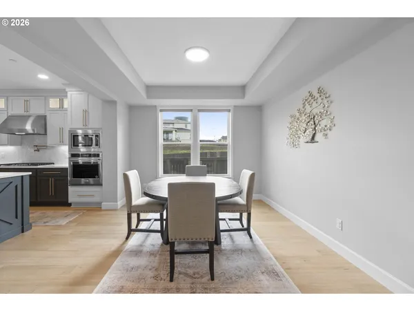 a dining room with furniture and window
