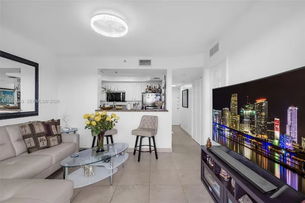 a kitchen with stainless steel appliances kitchen island granite countertop a sink and cabinets