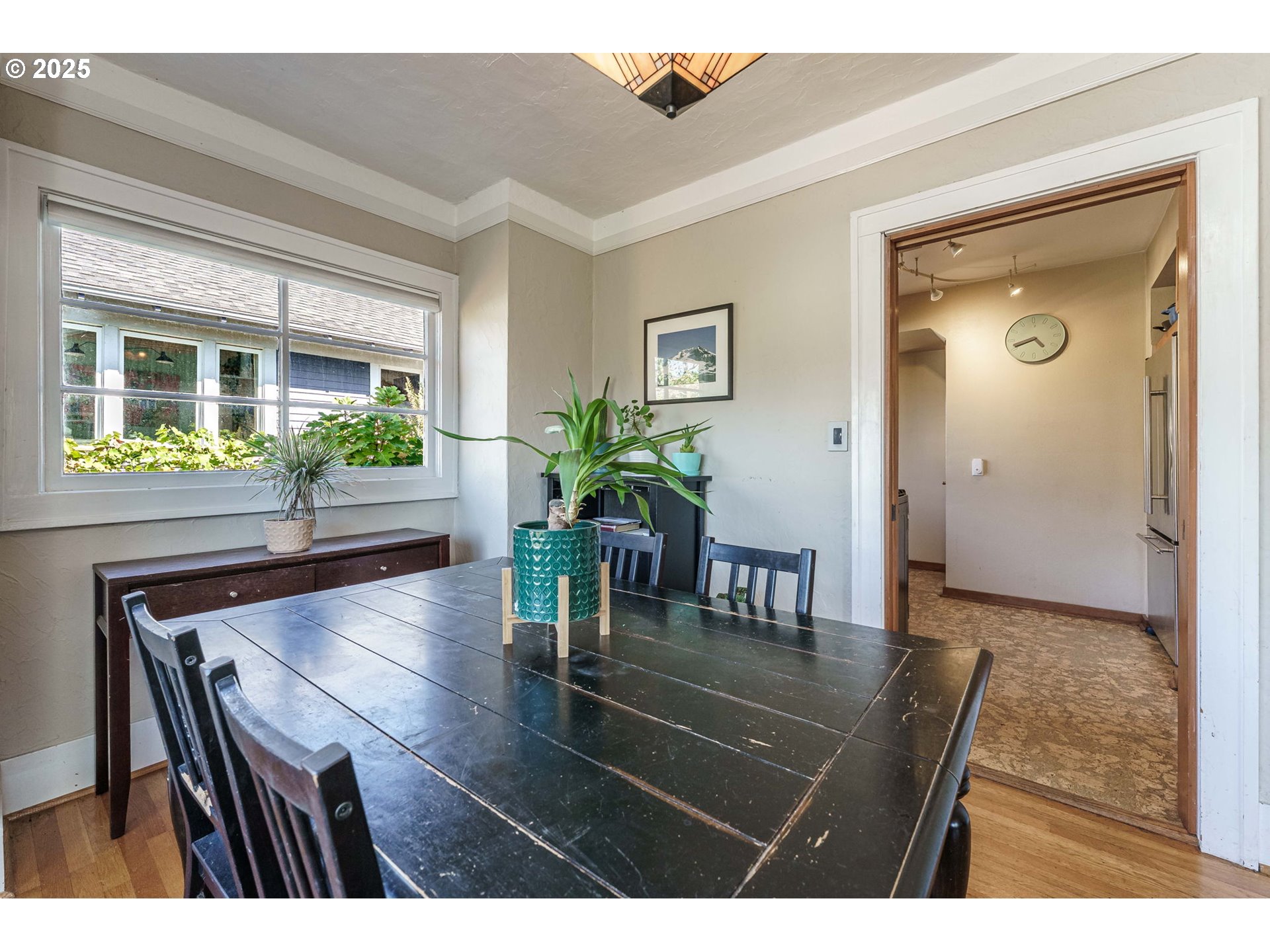 4216 Northeast 18th Avenue Portland, OR 97211 - Photo 11 of 46 a living room with furniture and a potted plant