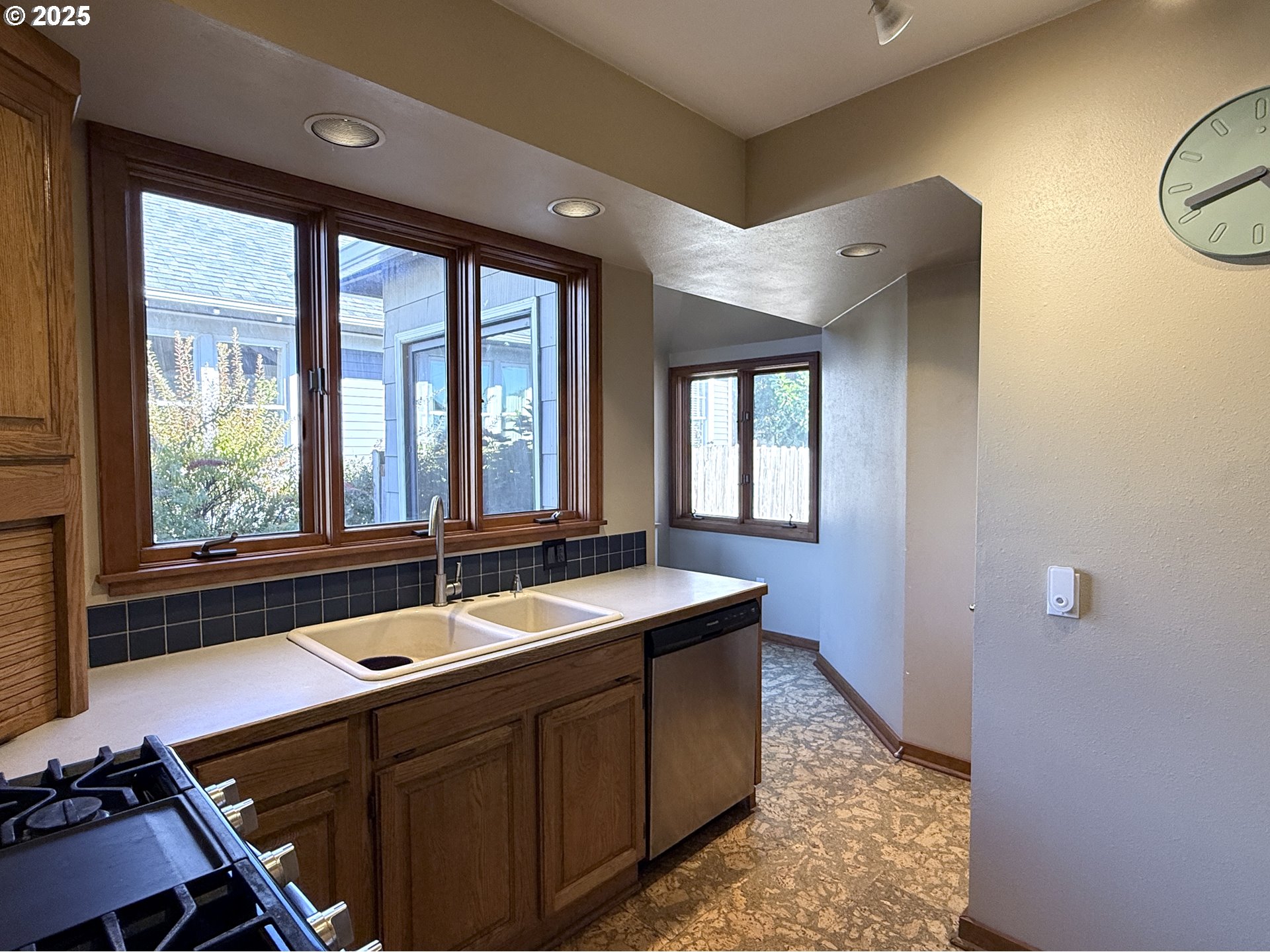 4216 Northeast 18th Avenue Portland, OR 97211 - Photo 13 of 46 a bathroom with a sink and a large mirror