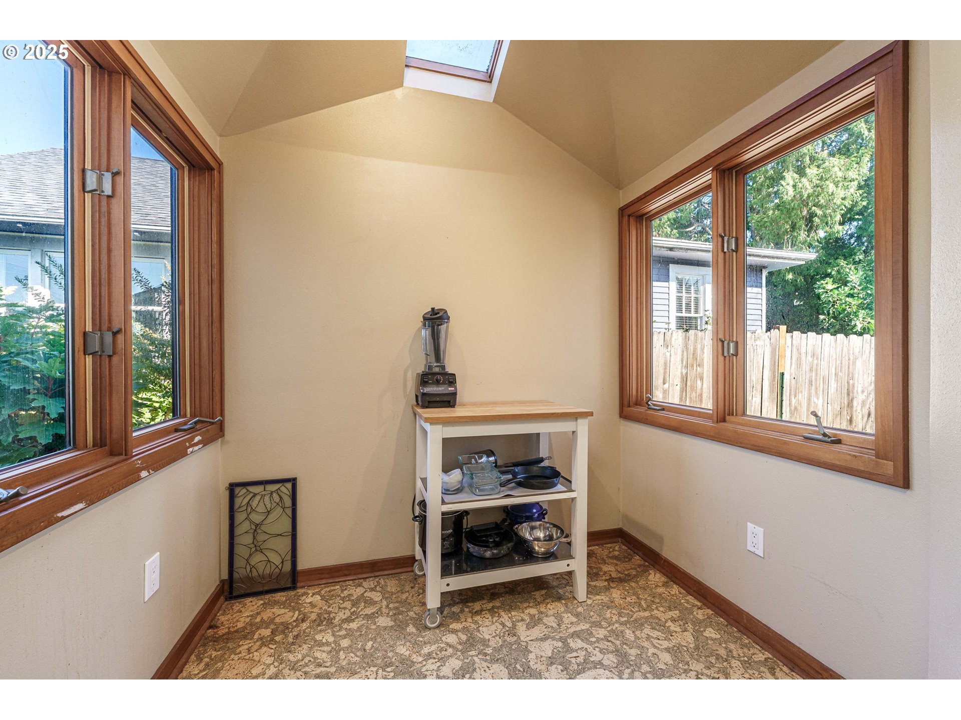 4216 Northeast 18th Avenue Portland, OR 97211 - Photo 15 of 46 a living room with a window and a table