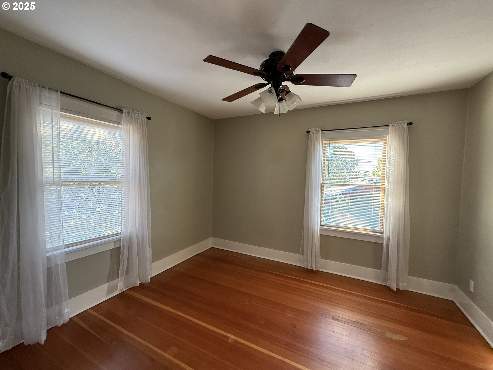 4216 Northeast 18th Avenue Portland, OR 97211 - Photo 20 of 46 a view of an empty room with wooden floor and a window