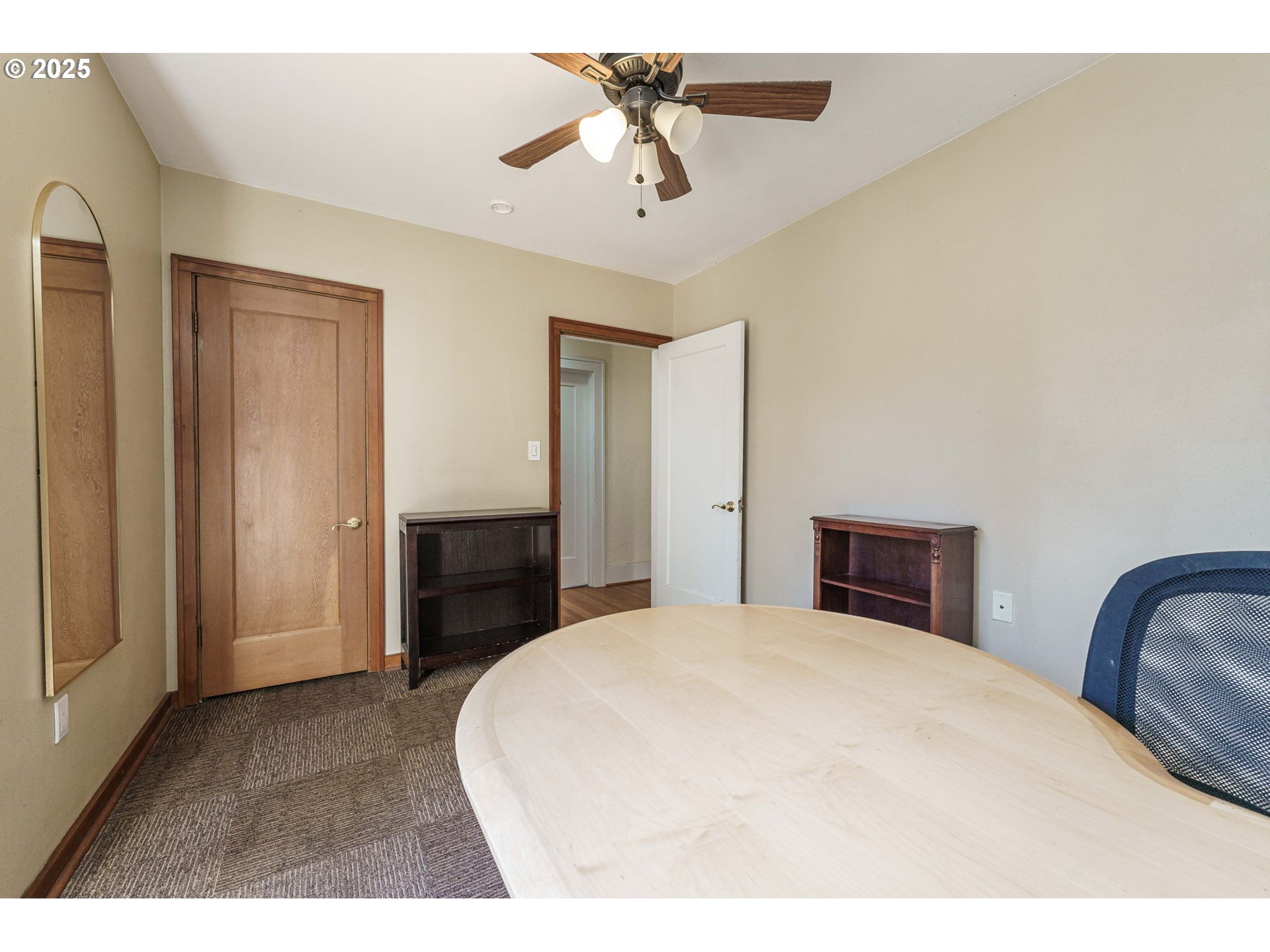 4216 Northeast 18th Avenue Portland, OR 97211 - Photo 22 of 46 a bedroom with a bed and a chandelier