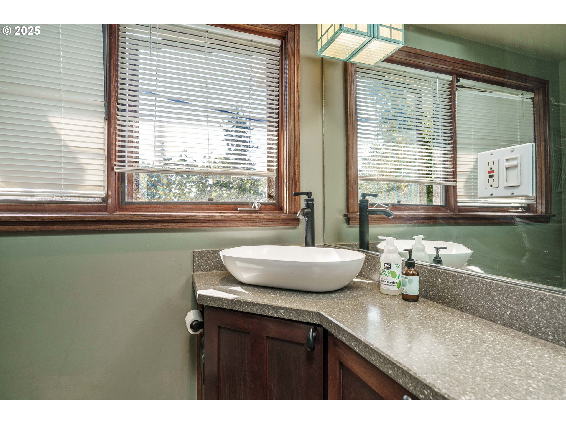 4216 Northeast 18th Avenue Portland, OR 97211 - Photo 24 of 46 a kitchen with a sink a window and cabinets