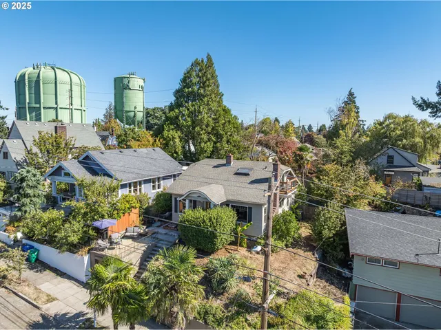a view of a house with garden and plants