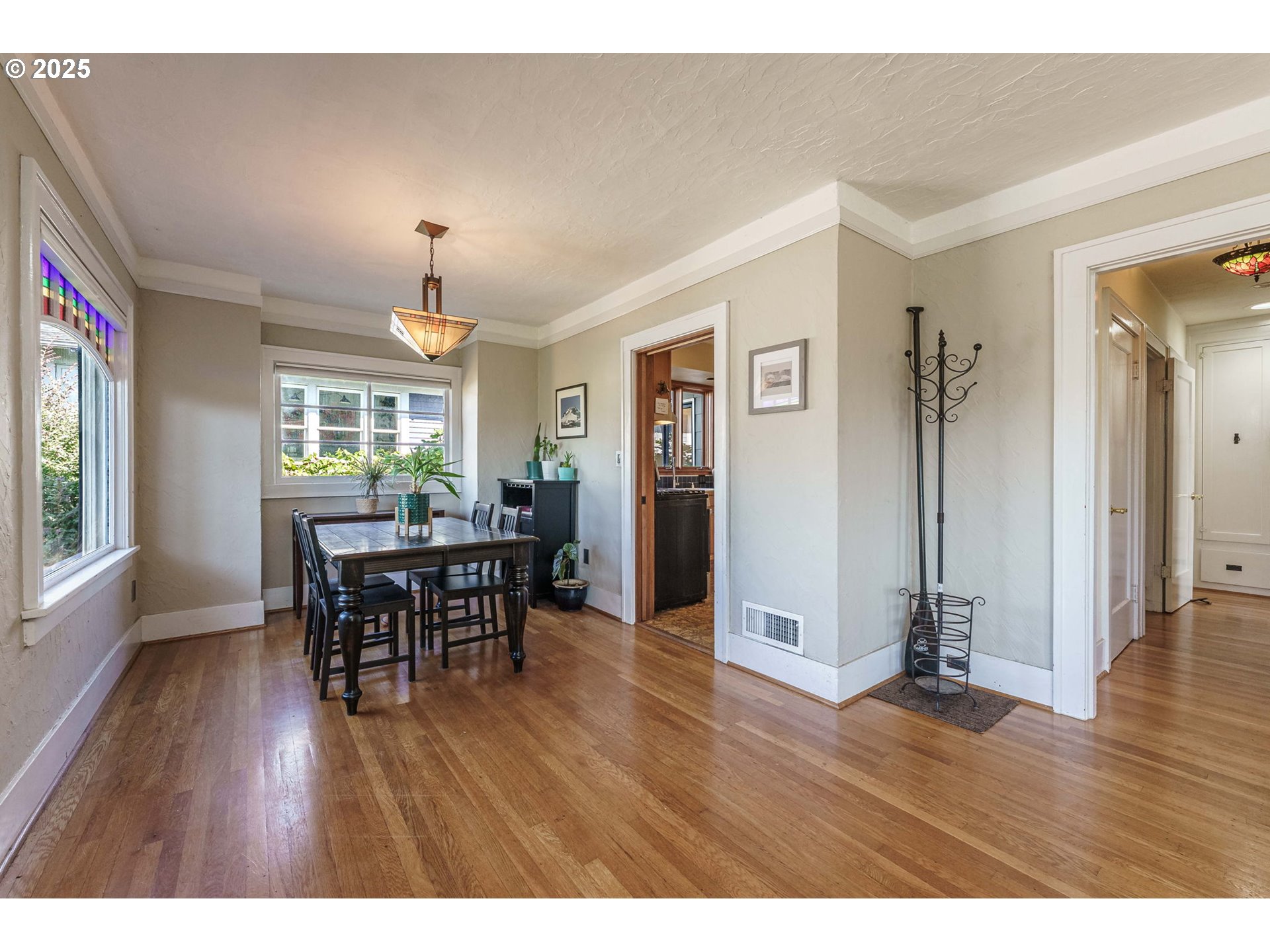 4216 Northeast 18th Avenue Portland, OR 97211 - Photo 7 of 46 a view of a dining room with furniture and wooden floor